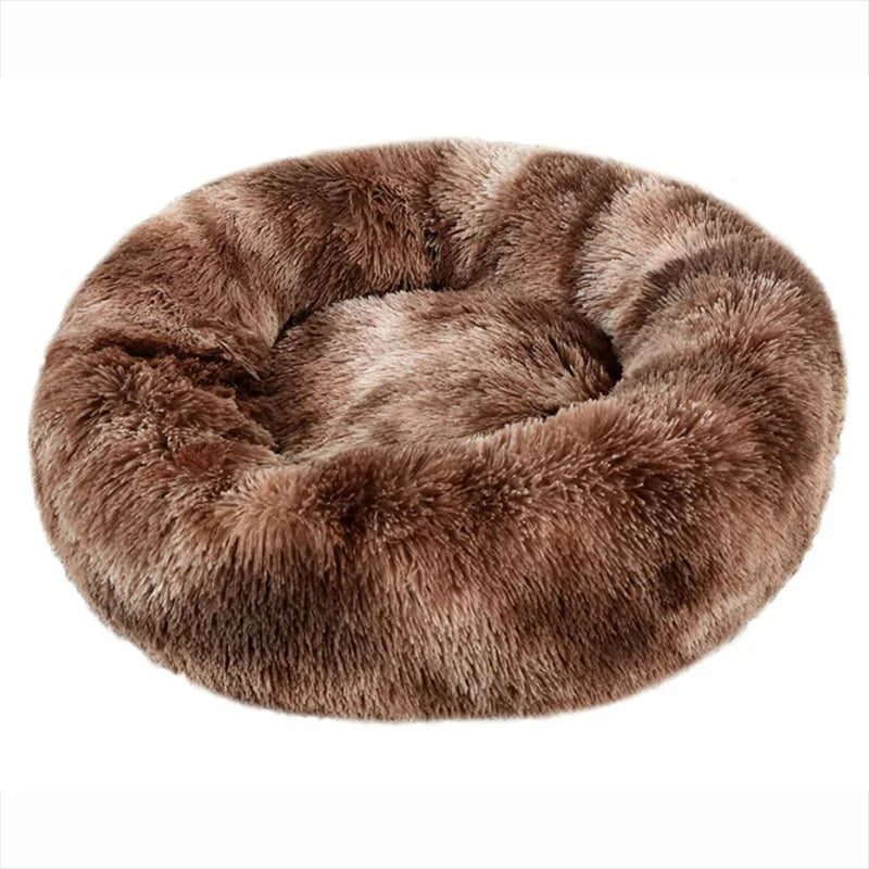 Brown faux fur donut pet bed on a white background