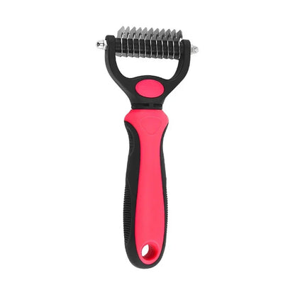 Red and black pet dematting comb with stainless steel blades and ergonomic handle on white background