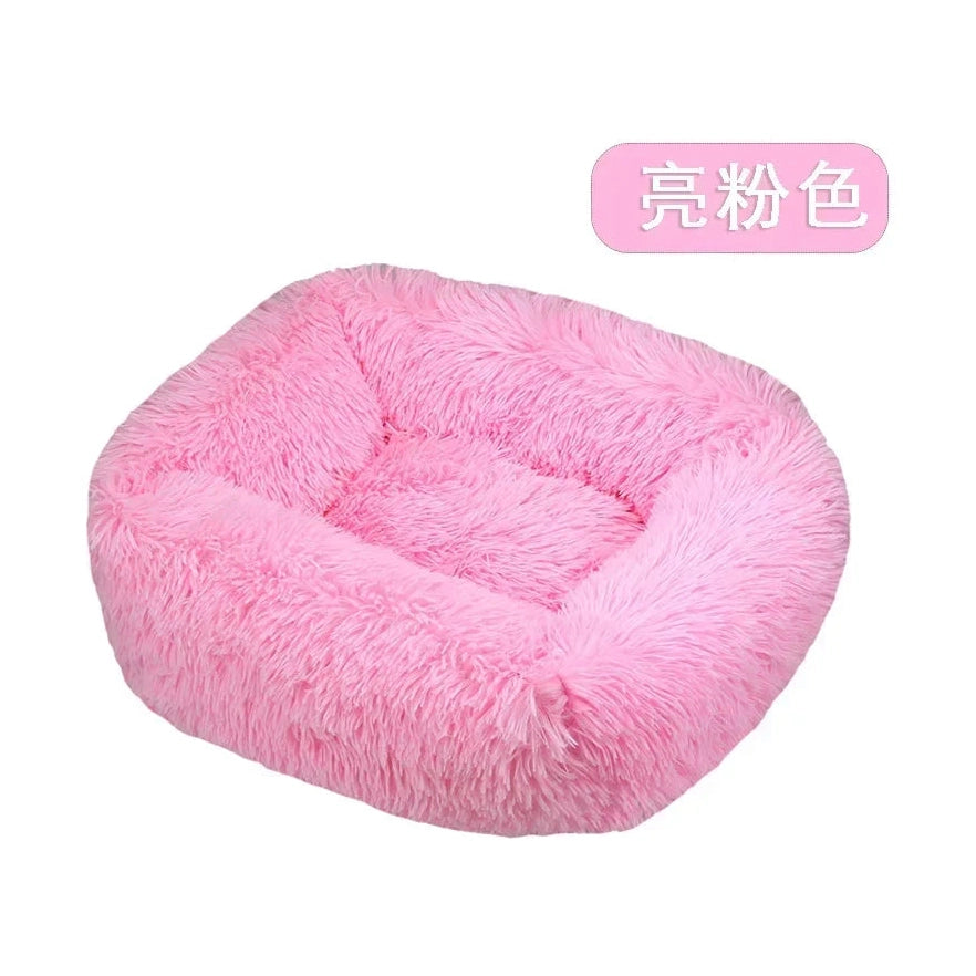 Soft fluffy pink pet bed with raised edges for small dogs and cats