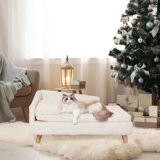 Waterproof Elevated Pet Stool Bed with a cat resting comfortably by a Christmas tree.